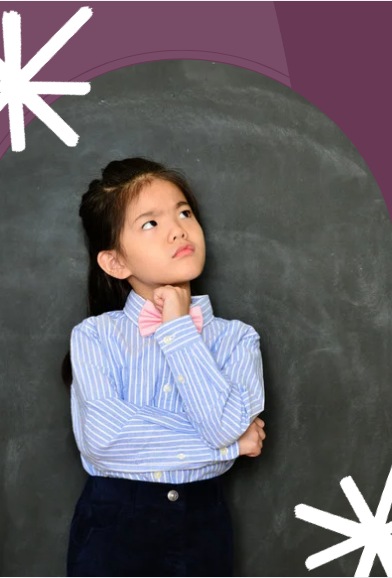 picture of girl standing in front of chalk board, with curious face