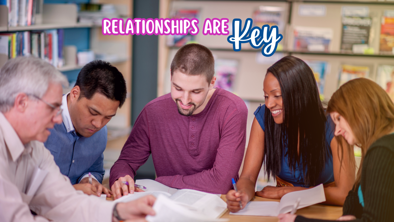 Group of diverse adults seated around a table working together representing an IEP meeting with various teachers and support staff. The works "Relationships are key" in colorful words at the top of th image.